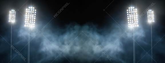Stadium lights and smoke against dark night sky