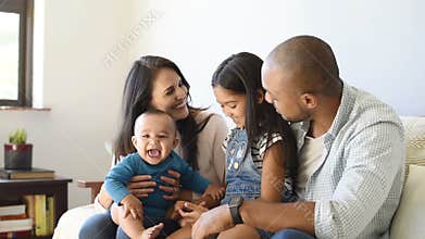 Family playing with baby