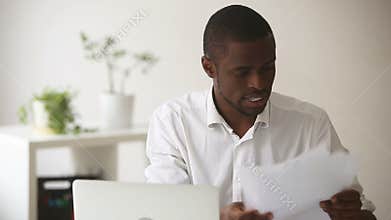 Stressed angry african businessman quits tired of difficult multitasking job