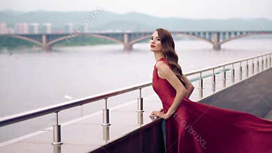 Beautiful woman in red fluttering dress.