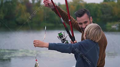 Happy father with son are fishing