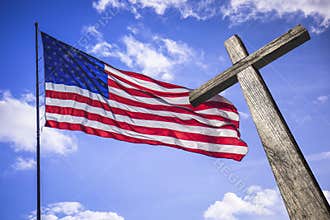 American flag with a wooden cross