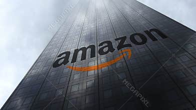 Amazon.com logo on a skyscraper facade reflecting clouds. Editorial 3D rendering