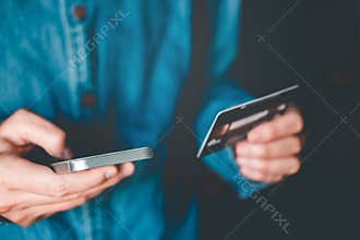 Online banking businessman using smartphone with credit card Fin