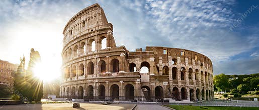Colosseum in Rome and morning sun, Italy