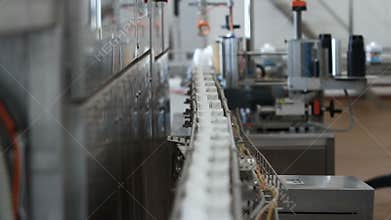 Milk in cardboard packages on a conveyor belt