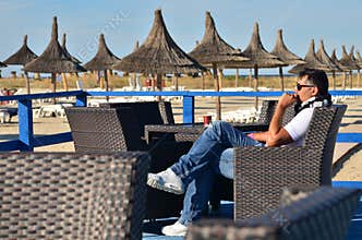 Man relaxing in the armchair outdoor