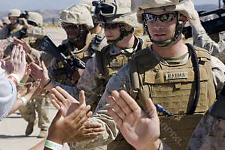 High-fives from soldiers