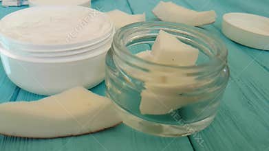 Cream skin drops coconut bio aromatic oil essential bottle organic cosmetics on blue wooden