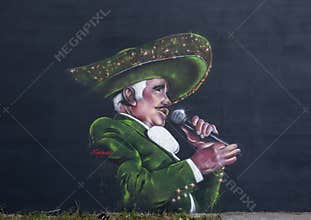 Mural by Ponchaveli featuring Vicente Fernandez, on the wall of Maxi Tax Services on Fort Worth Avenue in Oak Cliff