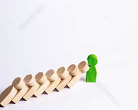 People in line fall like dominoes. green man stops the fall of people as dominoes. The concept of durability and strength