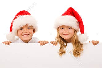 Happy christmas kids with white sign - isolated