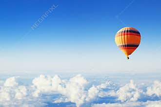 Inspiration or travel background, fly, colorful hot air balloon in blue sky