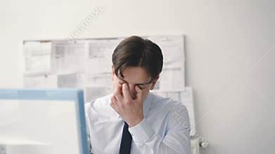 Worried businesman works with computer in office. 4K