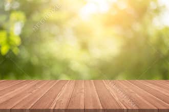 Empty wood table top on nature green blurred background at garden,space for montage show products