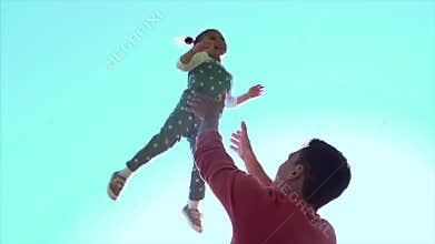 Father playing with daughter girl throwing in the air. Clip. Happy active child kid. Father throws his daughter