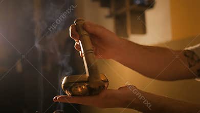 Man playing on tibetian singing bowl