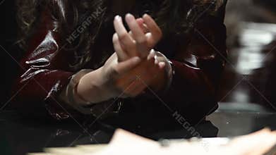Detained young woman in handcuffs waiting for interrogation in police station
