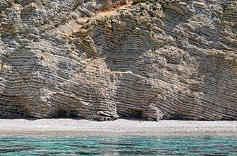 paradise beach part names Chomi Beach of Liapades at Corfu Island (Greece). Sedimentary rock cliff of chalk rocks