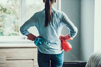 Young Woman in Gloves ready to Clean House