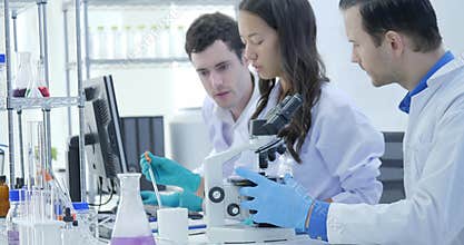 Dolly Shot of Medical Research Scientists Team Work on Modern Laboratory with Scientists Conducting experiments, Working