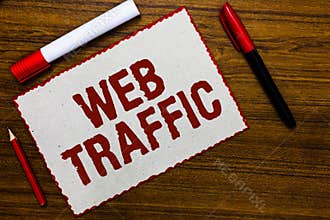 Handwriting text writing Web Traffic. Concept meaning Amount of data sent and received by visitors to a website White paper red bo