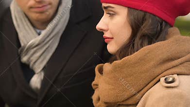 Couple breaking up quietly, man leaving woman, eyes down and feel sorrow closeup