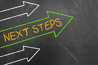 Next steps concept with chalk text and arrows on blackboard