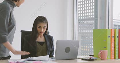 Businesswoman getting rebuke from his female boss in the office.