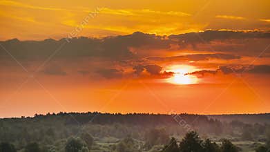 Sunrise Over Forest Landscape. Scenic View Of Morning Sky With Rising Sun Above Forest. Early Summer Nature Of Europe