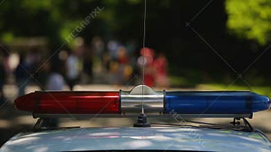 Police siren lighting on patrol vehicle, urgent evacuation of people, emergency
