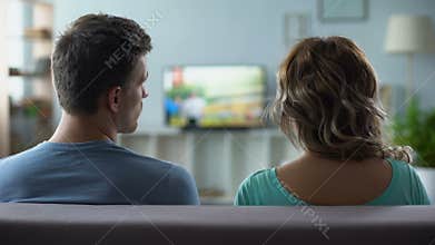 Man nervously switching channels, poor quality of digital smart tv connection