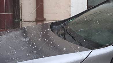 hail fall on the car, small hail. Bad weather conditions