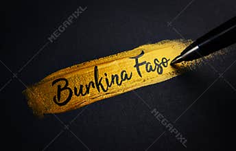 Burkina Faso Handwriting Text on Golden Paint Brush Stroke