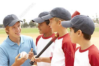 Young Boys In Baseball Team With Coach