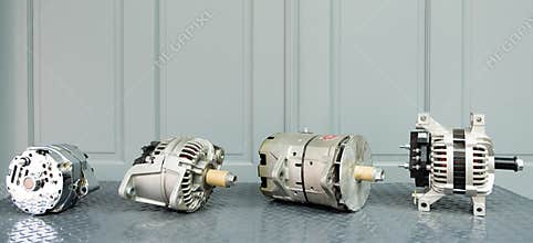 Car alternators on display on metal shelf/auto parts