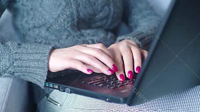 Closeup of business woman hand typing on laptop keyboard. Closeup of a female hands busy typing on a laptop. Woman`s