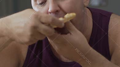 Fat man in hurry eating delivered pizza home, overweight problem, diet concept
