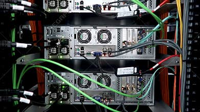 Back panel of powerful servers installed in the rack of the server room of the data center