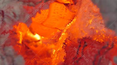 Glowing flame from charcoal and firewood