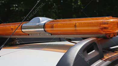 Flashing yellow warning lightbar at the security car