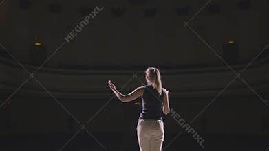 Young woman do rehearsal on the scene with script