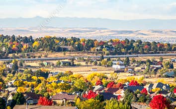 Denver Metro Area Residential Autumn Panorama with the view of a Front Range mountains in the distance