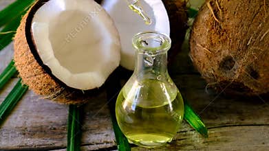 Coconut oil in a bottle for spa treatments. Selective focus.