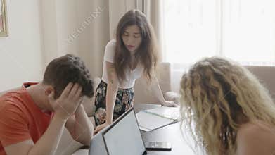 Team work trouble. Angry buisness woman boss shouting at her employees during meeting conference. People sitting ashamed