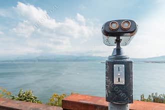 Coinoperated tourist telescope at the viewpoing on a shore of Lake Sevan in Armenia