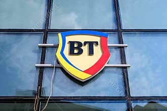 Bucharest, Romania - 6 June 2021: Large logo at the entrance of a BT or  Banca Transilvania Transilvania Bank branch in downtown