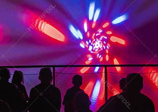 People watching video reel projected on the wall. Technology