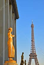Golden and Bronze Statues in a row on Trocadero Square with Eiffel tower in the background, Paris, France