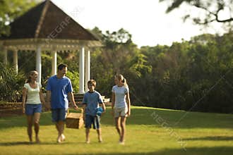 Family walking through park.